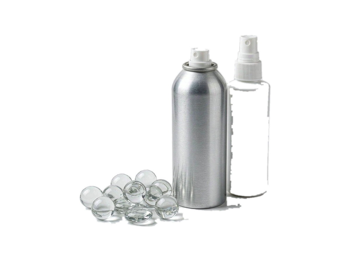 Large glass beads beside an aerosol can and a pump spray bottle