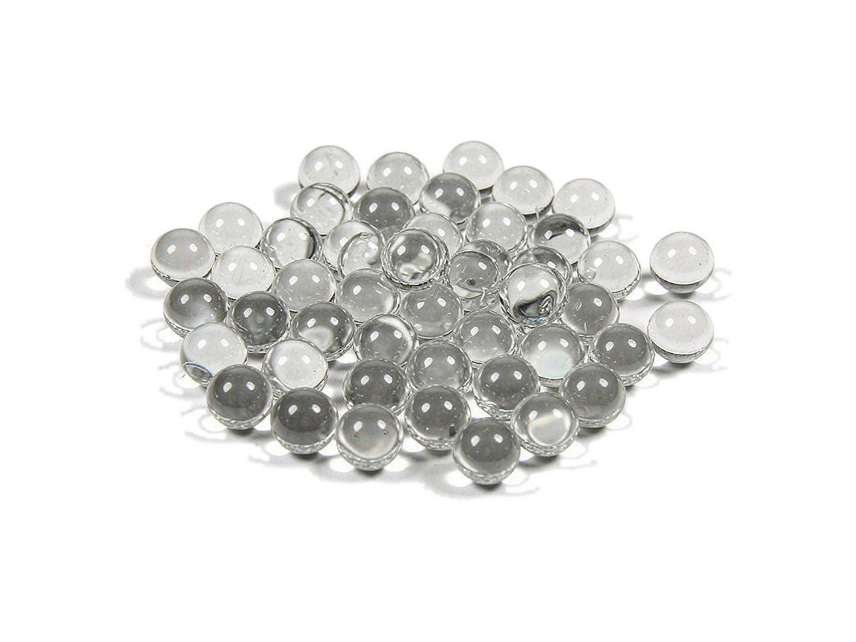 Water-clear precision glass valve beads, 2 to 14 mm, on a white background